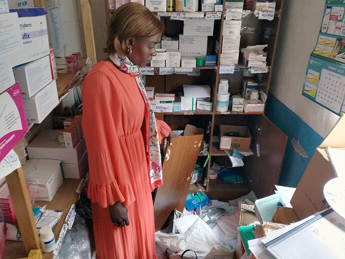 Sandra Bontamba, pharmacist at the United Methodist Irambo Health Center in Bukavu, Congo, takes stock of the medicine stolen during an attack on the hospital by armed men late on March 18. Bontamba said the medicine had been restocked the previous day. Photo by Philippe Kituka Lolonga, UM News.